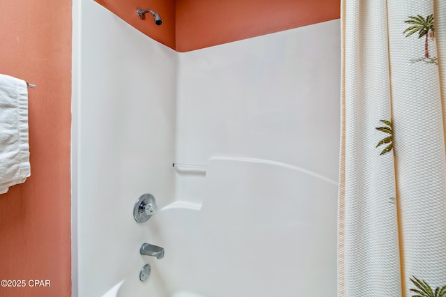 interior details featuring shower / bath combo with shower curtain