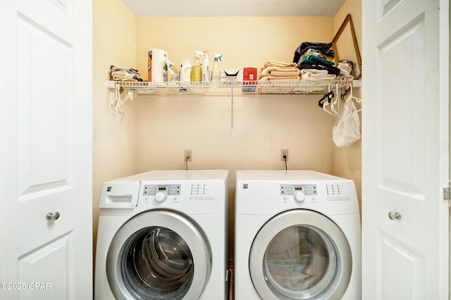 washroom featuring laundry area and separate washer and dryer