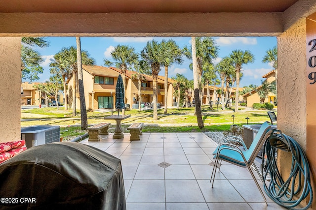 view of patio / terrace featuring a residential view and area for grilling