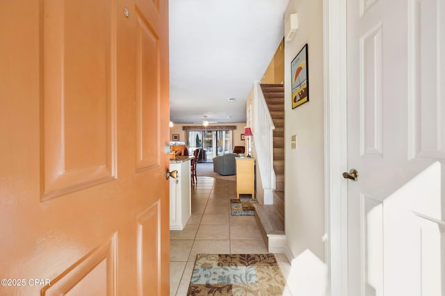 hallway with light tile patterned flooring