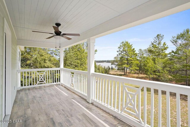 wooden terrace featuring ceiling fan