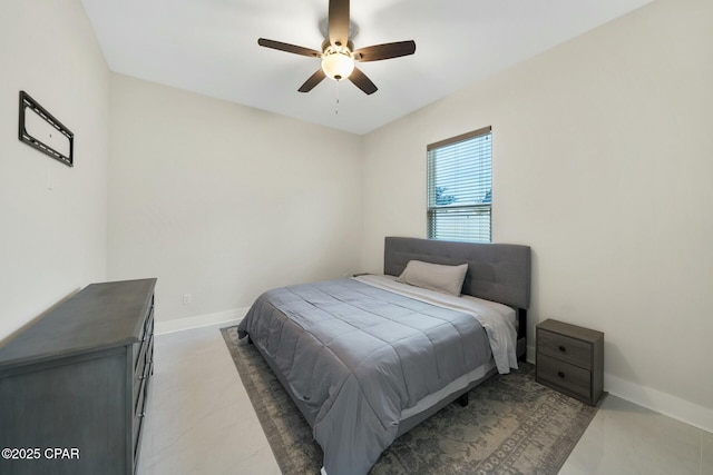 bedroom featuring baseboards and a ceiling fan