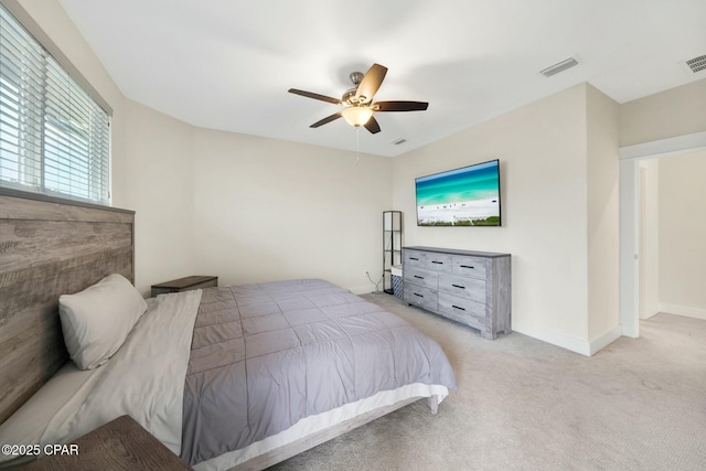 bedroom with visible vents, baseboards, carpet, and a ceiling fan