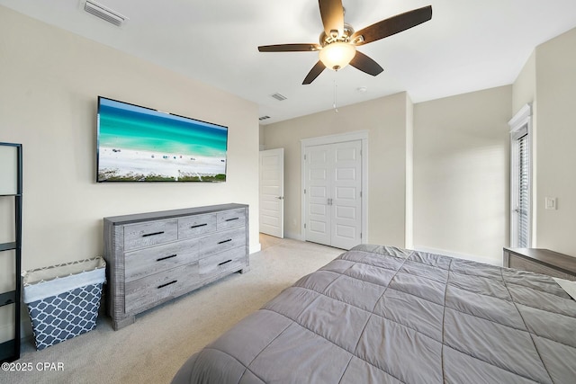 carpeted bedroom featuring visible vents and ceiling fan