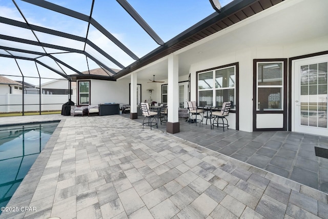 view of patio featuring a fenced in pool, an outdoor hangout area, a lanai, and a ceiling fan