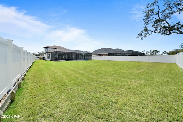 view of yard with a fenced backyard