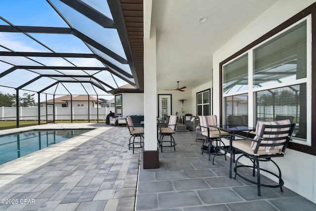 view of patio with glass enclosure, an outdoor living space, a fenced in pool, and fence