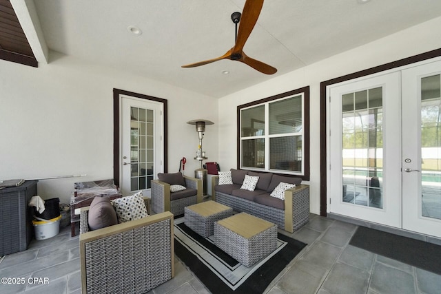 view of patio featuring french doors, an outdoor hangout area, and a ceiling fan