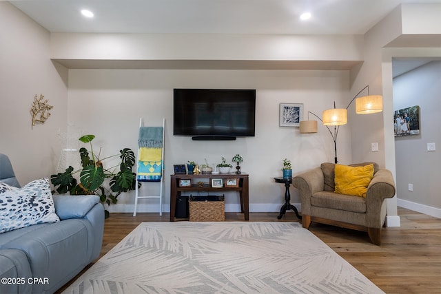 bedroom with recessed lighting, baseboards, and wood finished floors