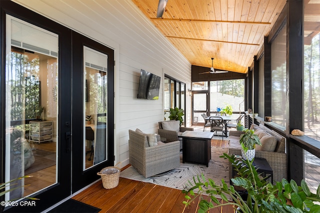 sunroom featuring wooden ceiling, lofted ceiling, and ceiling fan