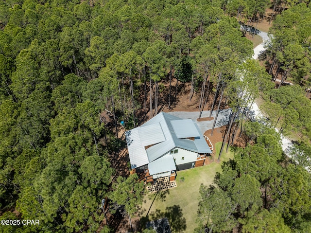 aerial view featuring a view of trees