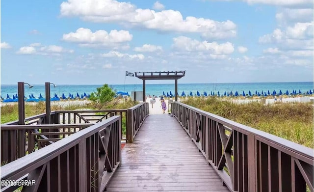 view of property's community featuring a view of the beach and a water view