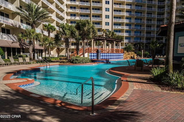 view of swimming pool with a pergola