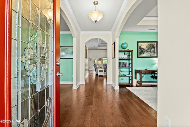 116 Lake Merial Blvd, Panama City, FL 32409 - entrance foyer with arched walkways, ornamental molding, dark wood-type flooring, and baseboards