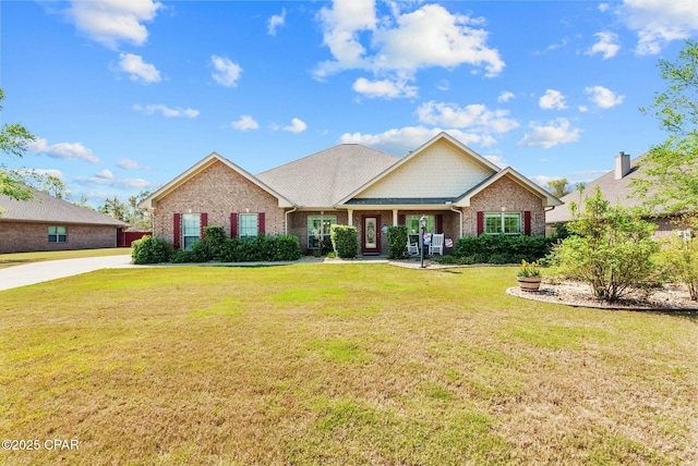 116 Lake Merial Blvd, Panama City, FL 32409 - view of front facade featuring brick siding and a front lawn