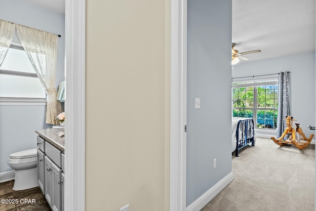 116 Lake Merial Blvd, Panama City, FL 32409 - hall with baseboards and dark carpet