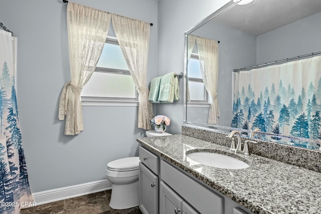 116 Lake Merial Blvd, Panama City, FL 32409 - bathroom featuring baseboards, toilet, healthy amount of natural light, and vanity