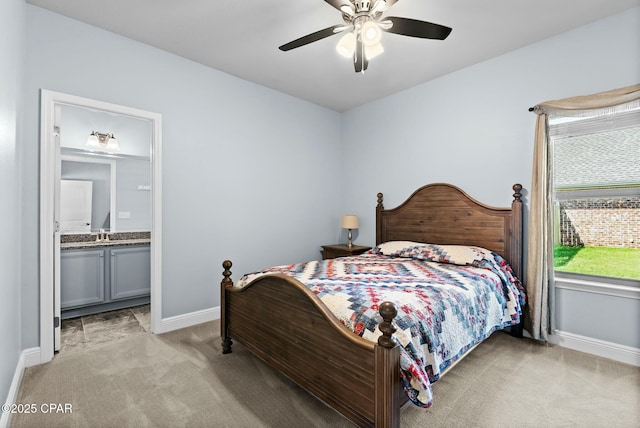 116 Lake Merial Blvd, Panama City, FL 32409 - bedroom with light colored carpet, baseboards, connected bathroom, and a ceiling fan