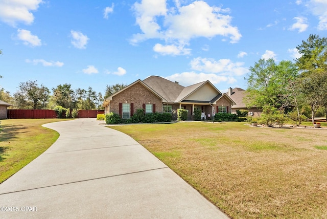 116 Lake Merial Blvd, Panama City, FL 32409 - view of front of home featuring brick siding and concrete driveway