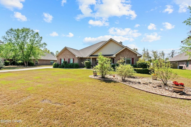 116 Lake Merial Blvd, Panama City, FL 32409 - ranch-style house with a front yard and brick siding