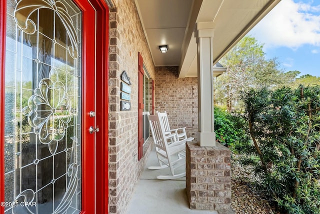 116 Lake Merial Blvd, Panama City, FL 32409 - property entrance with brick siding and a porch