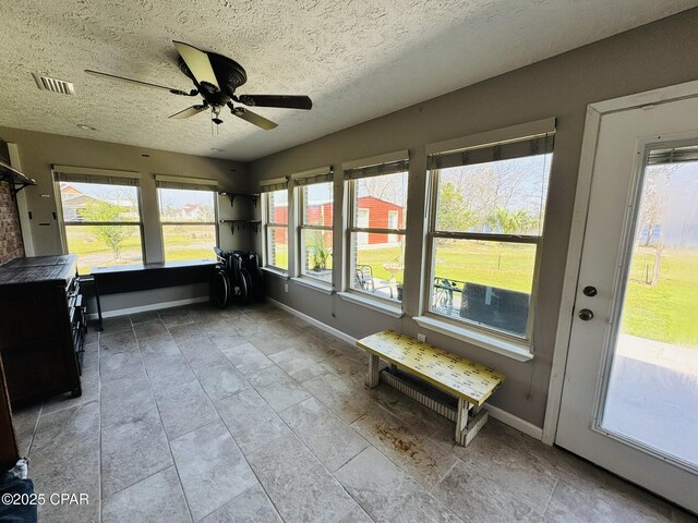 7224 Resota Ln, Panama City, FL 32409 - unfurnished sunroom with baseboards and a healthy amount of sunlight