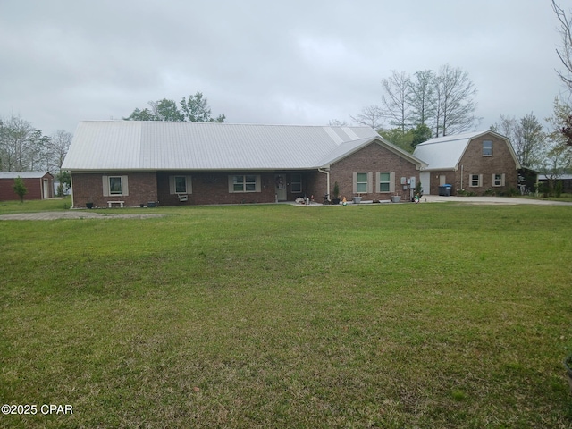 7224 Resota Ln, Panama City, FL 32409 - ranch-style house featuring brick siding, metal roof, and a front yard
