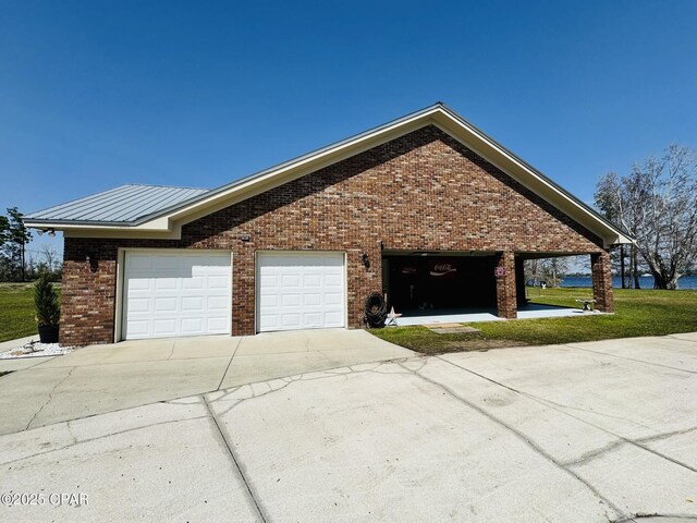 7224 Resota Ln, Panama City, FL 32409 - view of property exterior featuring concrete driveway and brick siding