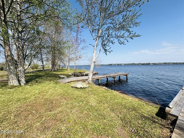 7224 Resota Ln, Panama City, FL 32409 - dock area with a water view and a lawn
