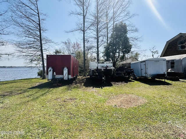 7224 Resota Ln, Panama City, FL 32409 - view of yard with a water view, an outbuilding, and a shed