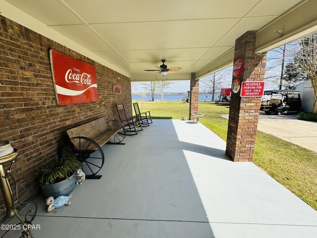 7224 Resota Ln, Panama City, FL 32409 - view of patio with a porch, ceiling fan, and a water view