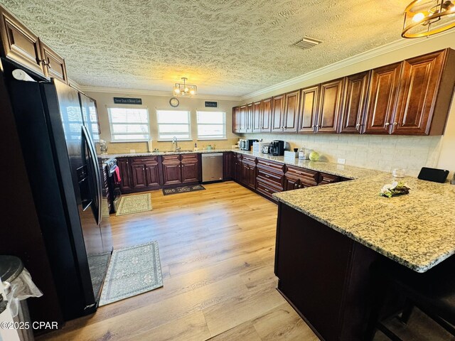 7224 Resota Ln, Panama City, FL 32409 - kitchen with dishwasher, ornamental molding, refrigerator with ice dispenser, a sink, and a peninsula