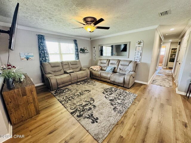 7224 Resota Ln, Panama City, FL 32409 - living room with crown molding, a ceiling fan, visible vents, and wood finished floors