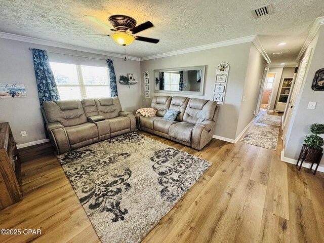 7224 Resota Ln, Panama City, FL 32409 - living area featuring a textured ceiling, a ceiling fan, visible vents, and wood finished floors