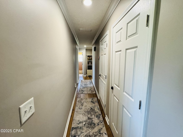 7224 Resota Ln, Panama City, FL 32409 - corridor with recessed lighting, a textured ceiling, baseboards, ornamental molding, and dark wood-style floors
