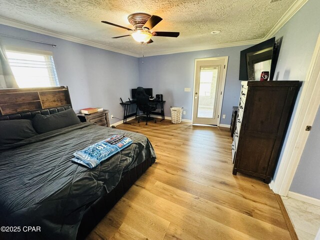7224 Resota Ln, Panama City, FL 32409 - bedroom featuring crown molding, light wood-style floors, and a textured ceiling