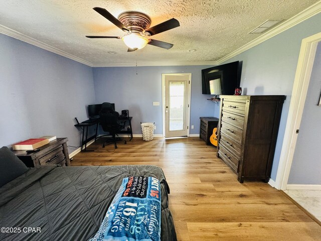 7224 Resota Ln, Panama City, FL 32409 - bedroom with a textured ceiling, ornamental molding, visible vents, light wood finished floors, and ceiling fan