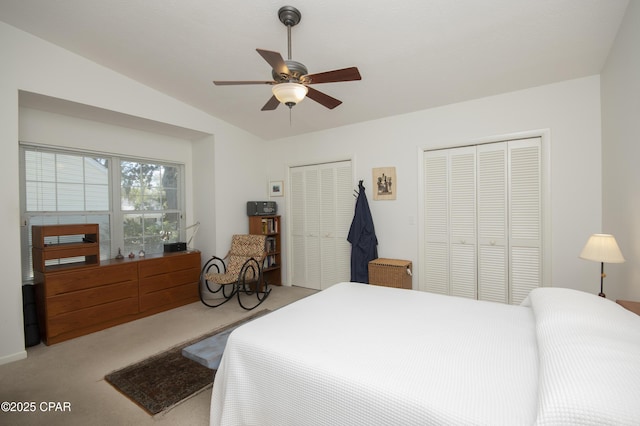 2026 Baker Ct Unit 13, Panama City, FL 32401 - bedroom with multiple closets, light colored carpet, ceiling fan, and vaulted ceiling
