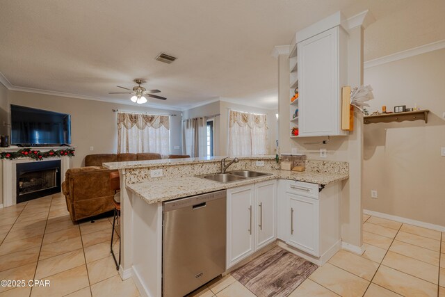 107 Summerwood Dr, Panama City Beach, FL 32413 - kitchen with dishwasher, a sink, a peninsula, open floor plan, and light tile patterned floors