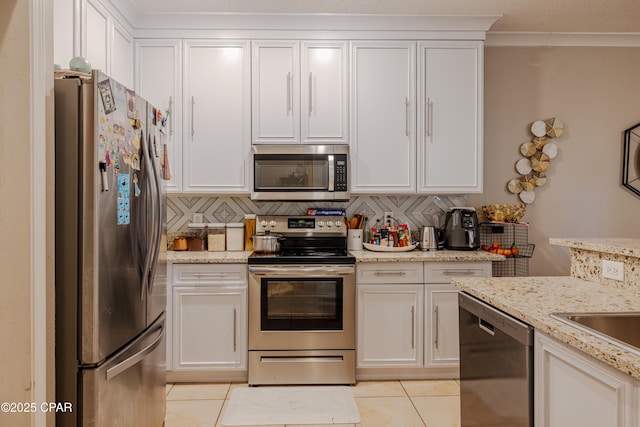 107 Summerwood Dr, Panama City Beach, FL 32413 - kitchen featuring stainless steel appliances, light tile patterned floors, and decorative backsplash
