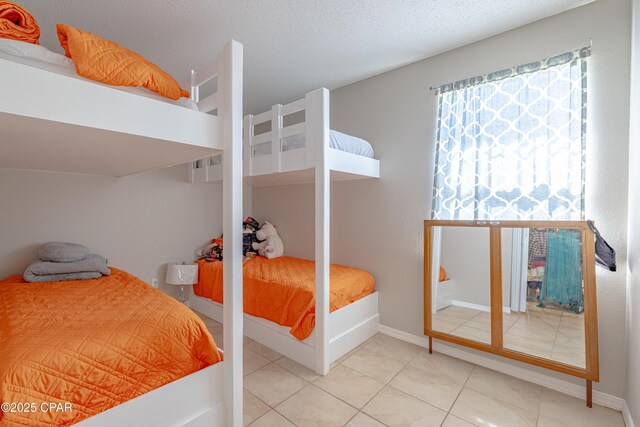 107 Summerwood Dr, Panama City Beach, FL 32413 - tiled bedroom with baseboards