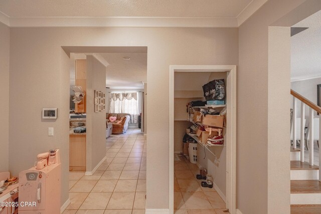 107 Summerwood Dr, Panama City Beach, FL 32413 - hall featuring ornamental molding, light tile patterned floors, and stairway