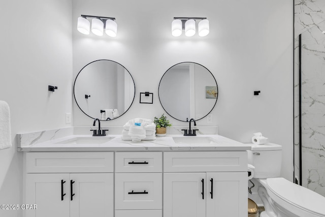 full bath featuring double vanity, toilet, and a sink