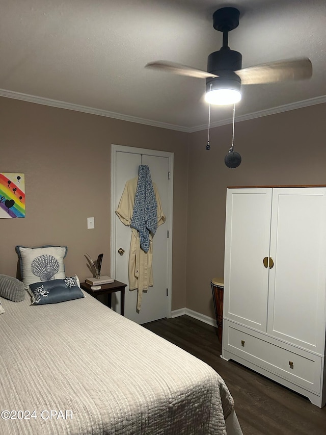 603 W Kansas Ave, Bonifay, FL 32425 - bedroom with crown molding, dark wood-style flooring, and ceiling fan