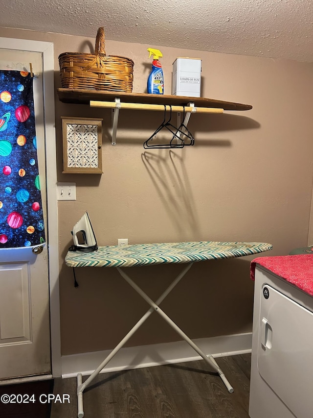 603 W Kansas Ave, Bonifay, FL 32425 - interior space featuring laundry area, wood finished floors, and a textured ceiling