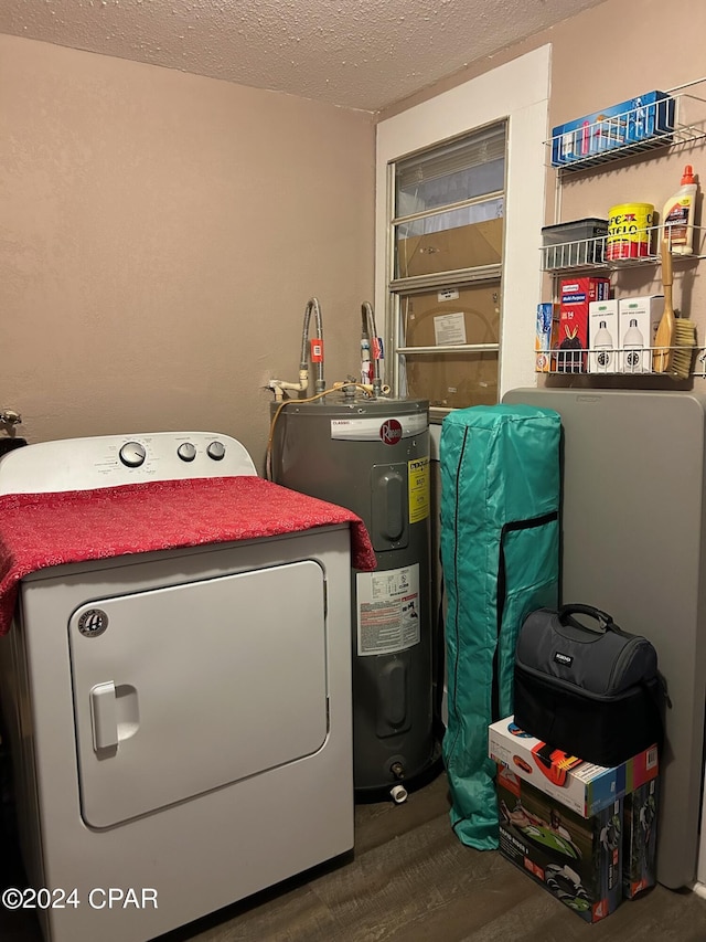 603 W Kansas Ave, Bonifay, FL 32425 - laundry room featuring laundry area, a textured ceiling, washer / clothes dryer, and electric water heater
