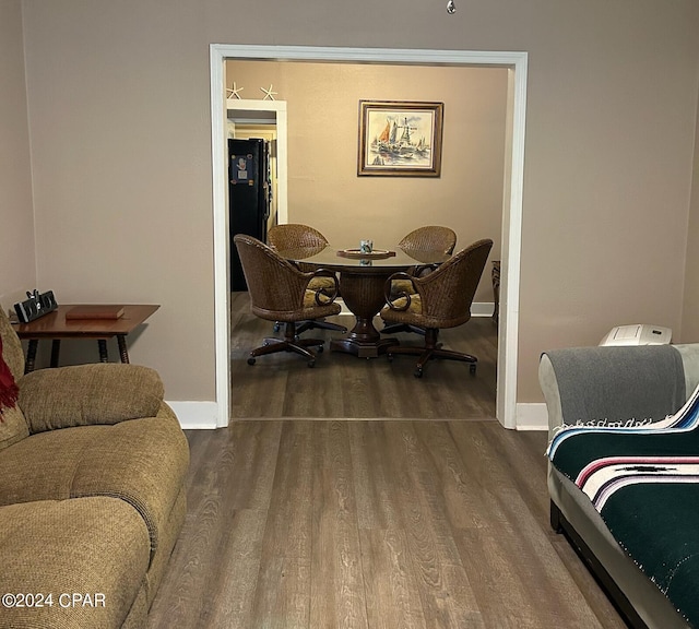 603 W Kansas Ave, Bonifay, FL 32425 - dining area featuring baseboards and wood finished floors