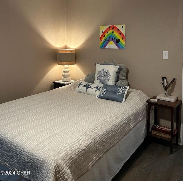 603 W Kansas Ave, Bonifay, FL 32425 - bedroom with dark wood-style floors
