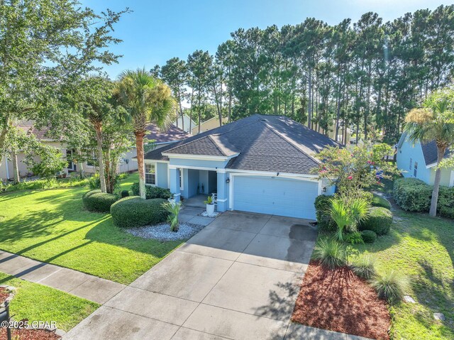 view of front of property with a shingled roof, concrete driveway, a front yard, stucco siding, and an attached garage