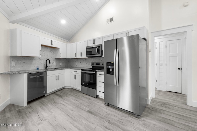5408 Lagoon Way Unit 5, Panama City, FL 32408 - kitchen with light stone counters, visible vents, a sink, appliances with stainless steel finishes, and tasteful backsplash